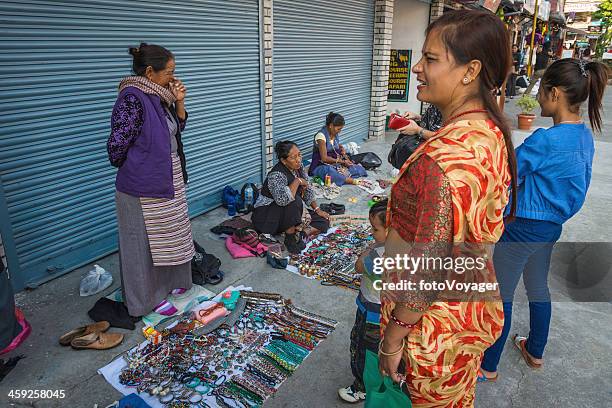 tibetan women selling handicrafts in pokhara nepal - nepal city stock pictures, royalty-free photos & images