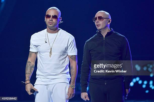 Singer Wisin and rapper Pitbull perform onstage during rehearsals for the 15th annual Latin GRAMMY Awards at the MGM Grand Garden Arena on November...