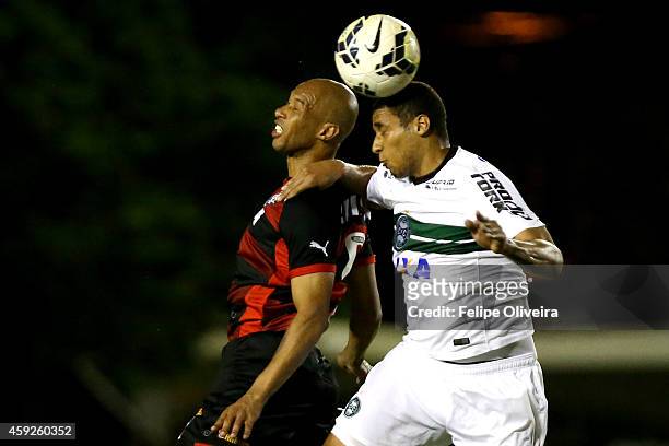 Dinei of Vitoria battles for the ball with Sergio Manoel during the match between Vitoria and Coritiba as part of Brasileirao Series A 2014 at...