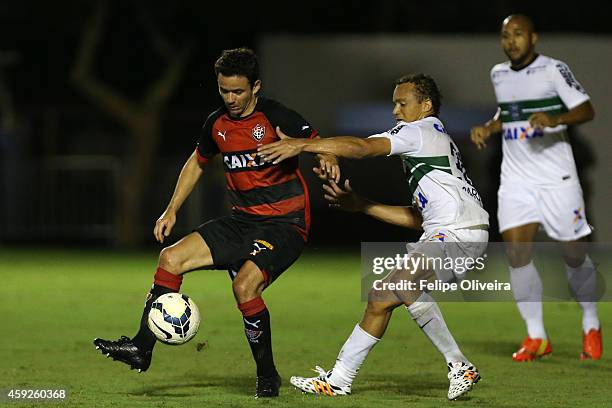 Juan of Vitoria battles for the ball withn Carlinhos of Coritiba during the match between Vitoria and Coritiba as part of Brasileirao Series A 2014...