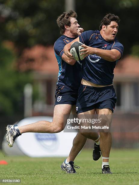Jeremy Tilse is tackled during a Waratahs Super Rugby pre-season training session at Moore Park on November 20, 2014 in Sydney, Australia.