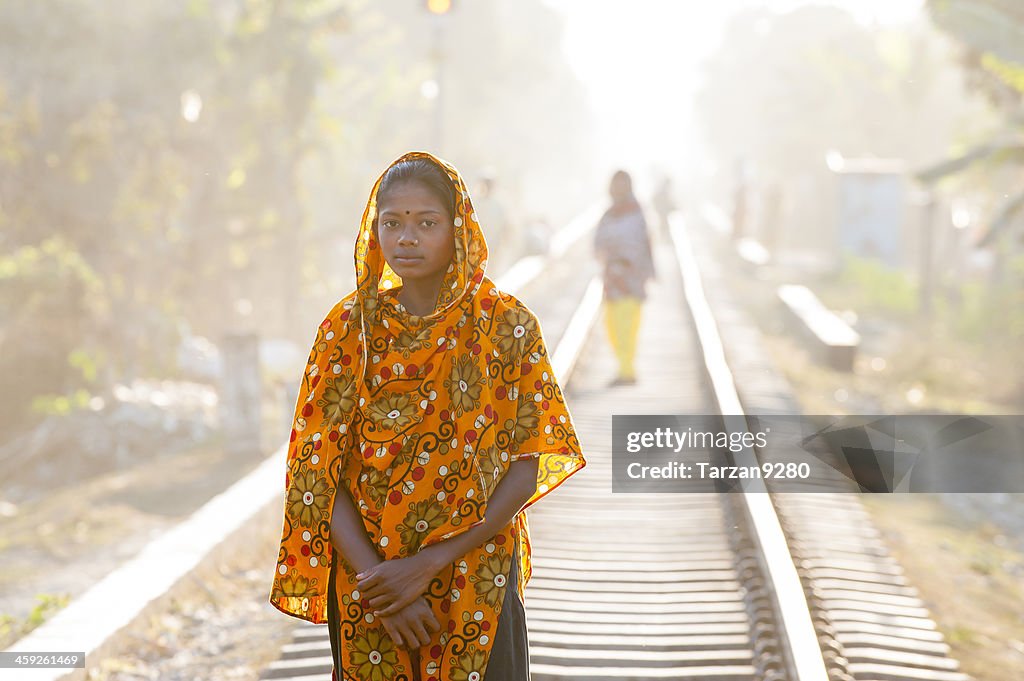 Bengali girl standing on the railway