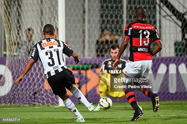 Dodo of Atletico MG and Paulo Victor and Marcelo of Flamengo battle for the ball during a match between Atletico MG and Flamengo as part of...