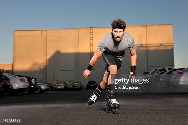 man roller-skating in parking log, sunset - parking log stock pictures, royalty-free photos & images