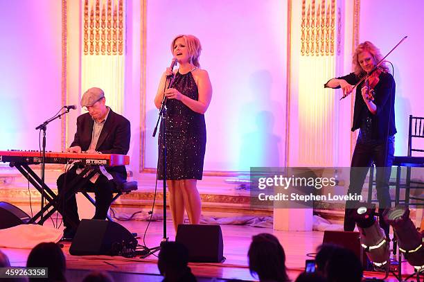 Singer Trisha Yearwood performs on stage at the 2nd Annual Save The Children Illumination Gala at the Plaza on November 19, 2014 in New York City.