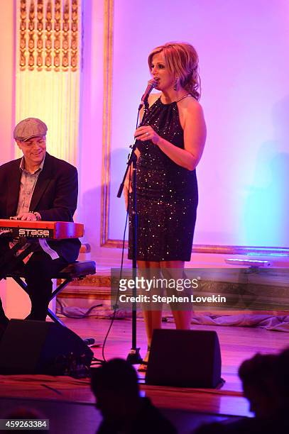 Singer Trisha Yearwood performs on stage at the 2nd Annual Save The Children Illumination Gala at the Plaza on November 19, 2014 in New York City.