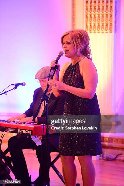 Singer Trisha Yearwood performs on stage at the 2nd Annual Save The Children Illumination Gala at the Plaza on November 19, 2014 in New York City.