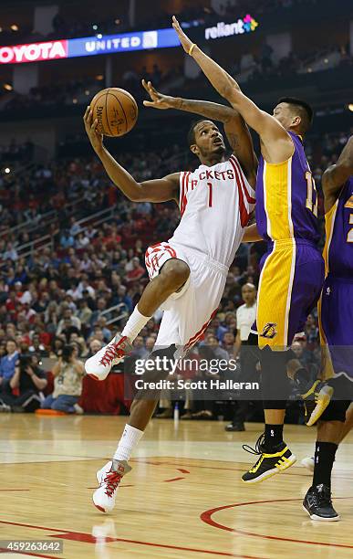 Trevor Ariza of the Houston Rockets takes a shot over Jeremy Lin of the Los Angeles Lakers during their game at the Toyota Center on November 19,...