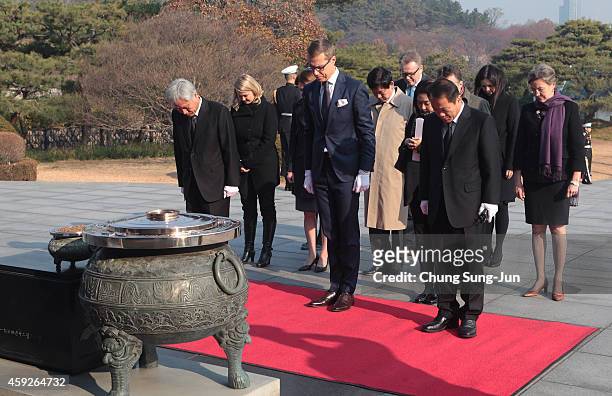 Finnish Prime Minister Alexander Stubb pays a silent tribute at Seoul National Cemetery during his visit to South Korea on November 20, 2014 in...