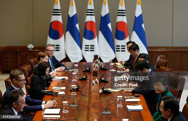 Finnish Prime Minister Alexander Stubb talks with South Korean President Park Geun-Hye during their meeting at the Presidential Blue House on...