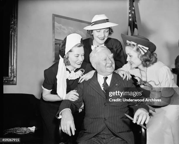 Vice President John Nance Garner was in fine fettle as he greeted visiting South Carolina azalea beauty queens, Washington DC, May 1938. L-R:...