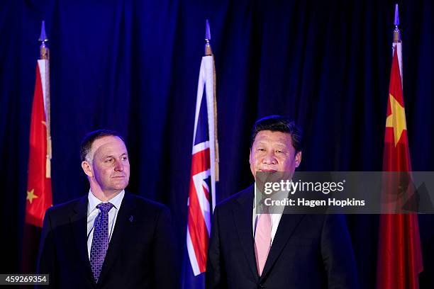 President Xi Jinping of China and Prime Minister John Key of New Zealand look on during a signing of NZ-China agreements at Premiere House on...