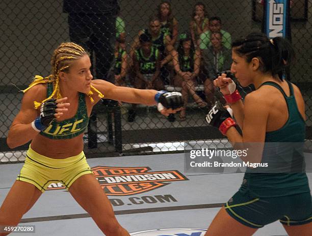 Team Pettis fighter Felice Herrig throws a punch at team Pettis fighter Randa Markos during filming of season twenty of The Ultimate Fighter on...