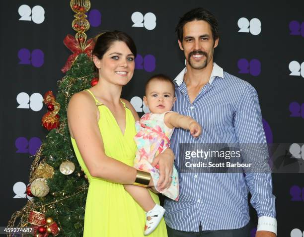 Mitchell Johnson of Australia poses with his wife Jessica Bratich-Johnson and daughter Rubika ahead of the Cricket Australia Christmas Day Lunch at...