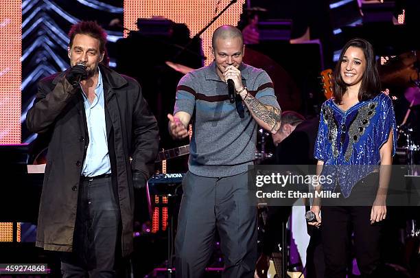 Recording artist Vicentico, recording artist Rene Perez Joglar of music group Calle 13, and recording artist Ileana Cabra Joglar perform onstage...