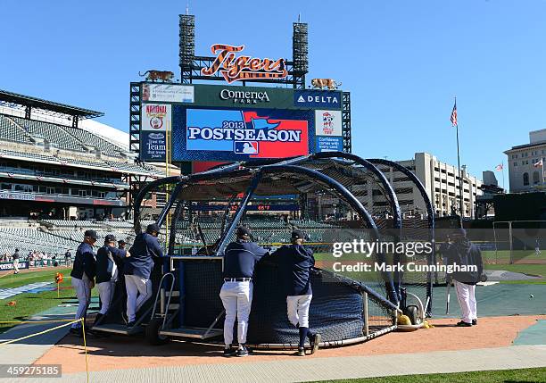 Detroit Tigers players and coaches stand at the batting cage prior to Game Four of the American League Division Series against the Oakland Athletics...