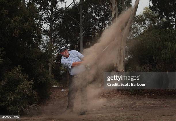 Steven Bowditch of Australia plays a shot on the 18th hole during day one of the 2014 Australian Masters at The Metropolitan Golf Course on November...