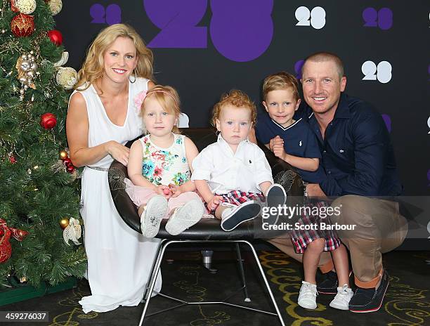 Brad Haddin of Australia poses with his wife Karina Haddin and children Mia, Hugo and Zac ahead of the Cricket Australia Christmas Day Lunch at Crown...