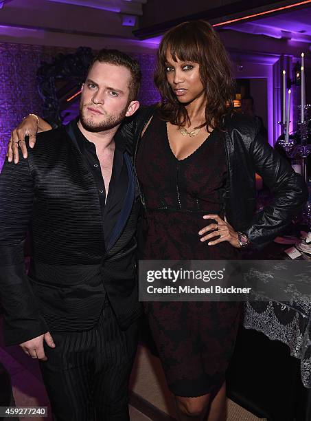 Designer August Getty and super model Tyra Banks attends the August Getty Atelier Dinner at the Montage Hotel Rooftop Grill on November 19, 2014 in...