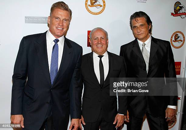 Dolph Lundgren, Peter Repovich and guest attend the 13th Annual LAPD PPL Eagle & Badge Foundation Gala at the Hyatt Regency Century Plaza on November...