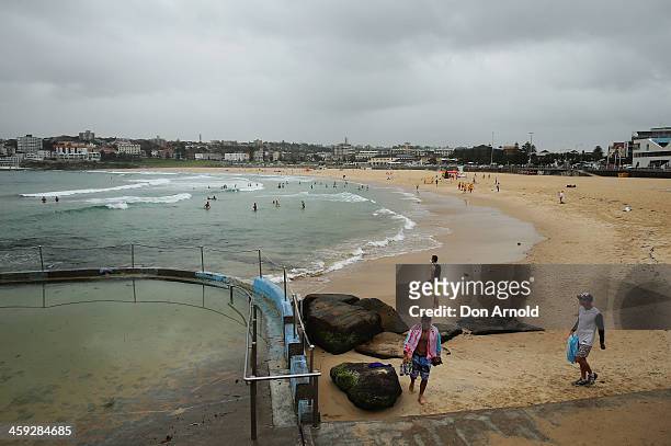 Due to wind, rain and generally poor weather, an unusually small amount of people turned out to Bondi Beach on December 25, 2013 in Sydney,...