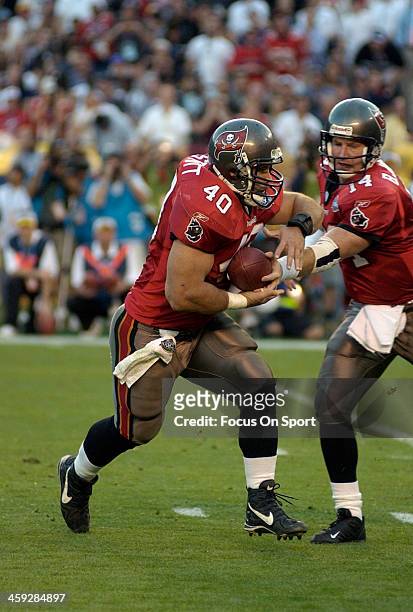 Mike Alstott of the Tampa Bay Buccaneers takes the handoff from Brad Johnson against the Oakland Raiders during Super Bowl XXXVII at Qualcomm Stadium...