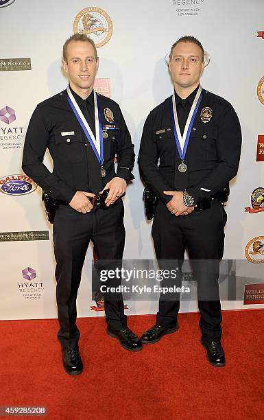 Medal of Valor recipients David Blake and Mark Austin arrive at the 2014 Eagle & Badge Foundation Gala at the Hyatt Regency Century Plaza on November...