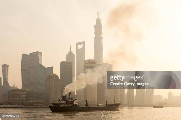 Ship sails up the Huangpu River as heavy smog engulfs the city on December 25, 2013 in Shanghai, China. Heavy smog covered many parts of China on...