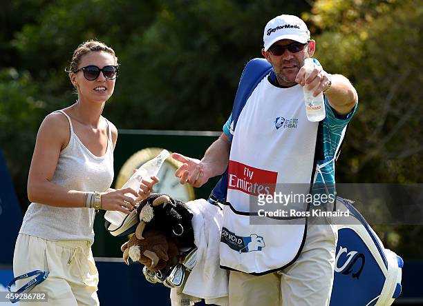 Katharina Boehm, the girlfriend of Sergio Garcia collects a bottle of water from his caddie during the first round of the DP World Tour Championship...
