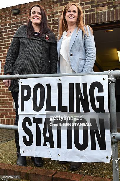 Conservative parliamentary candidate Kelly Tolhurst and sister Katie Tolhurst arrive to vote in the by-election in Rochester, Kent, southern England,...