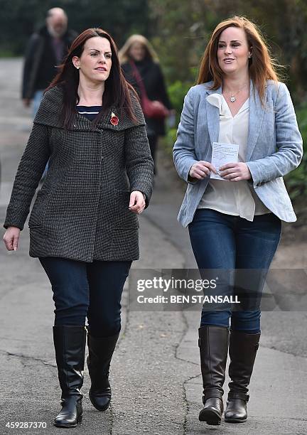 Conservative parliamentary candidate Kelly Tolhurst and sister Katie Tolhurst arrive to vote in the by-election in Rochester, Kent, southern England,...