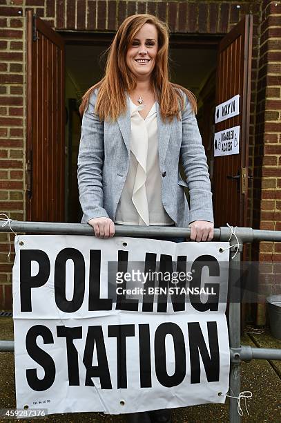 Conservative parliamentary candidate Kelly Tolhurst poses after casting her vote in the by-election in Rochester, Kent, southern England, on November...