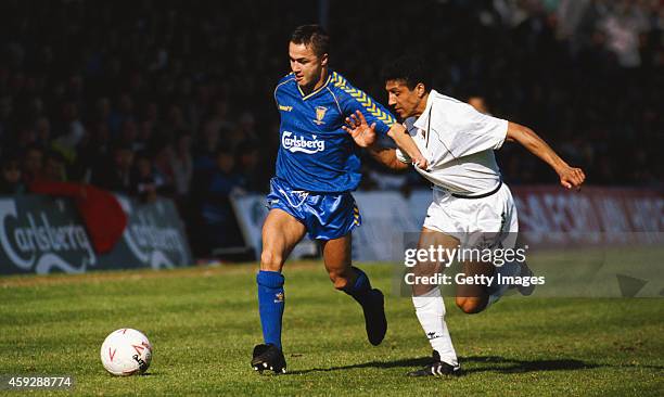 Spurs defender Chris Hughton challenges Wimbledon player Dennis Wise during a League Division One match between Wimbledon and Tottenham Hotspur at...