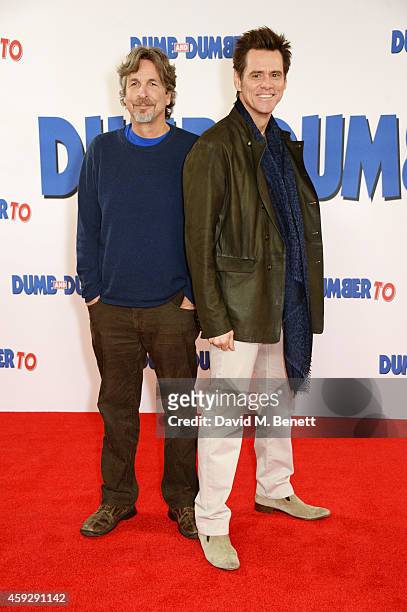 Director Peter Farrelly and actor Jim Carrey attend a photocall for "Dumb and Dumber To" on November 20, 2014 in London, England.