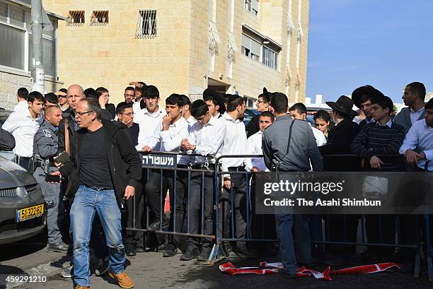 Israeli people gather at a synagogue on November 18, 2014 in Jerusalem, Israel. Four Israelis have been killed and several others wounded in a terror...