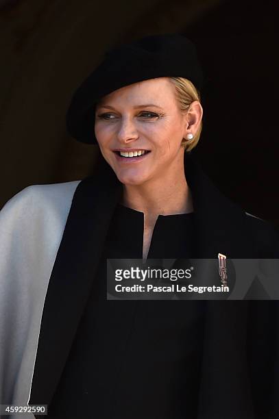 Princess Charlene of Monaco greets the crowd from the palace's balcony during the National Day Parade as part of Monaco National Day Celebrations on...