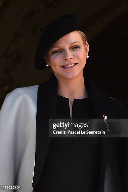 Princess Charlene of Monaco greets the crowd from the palace's balcony during the National Day Parade as part of Monaco National Day Celebrations on...