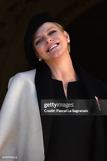 Princess Charlene of Monaco greets the crowd from the palace's balcony during the National Day Parade as part of Monaco National Day Celebrations on...