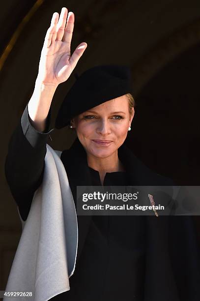 Princess Charlene of Monaco greets the crowd from the palace's balcony during the National Day Parade as part of Monaco National Day Celebrations on...