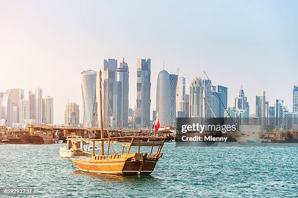 traditional dhows in front of modern doha skyline, qatar - doha stock pictures, royalty-free photos & images