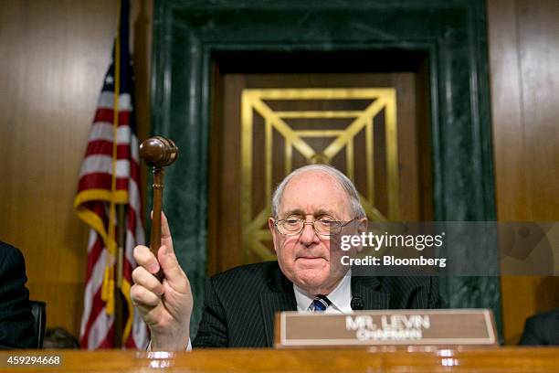 Senator Carl Levin, a Democrat from Michigan and chairman of the Senate Permanent Subcommittee on Investigations, gavels in to a hearing in...