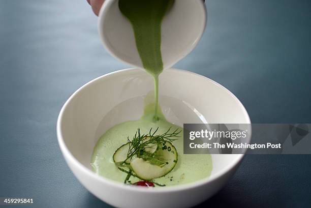 Chef Ron Tanaka offers cucumber soup poured into a bowl with Greek yogurt, celery, cumin, dill and mint at the newly opened Thally restaurant on 9th...
