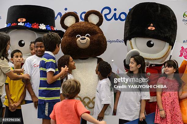 Misha , the mascot from Moscow 1980 Olympic Games poses with Wenlock and Mandeville, from the London 2012 Olympic and Paralympic Games respectively,...