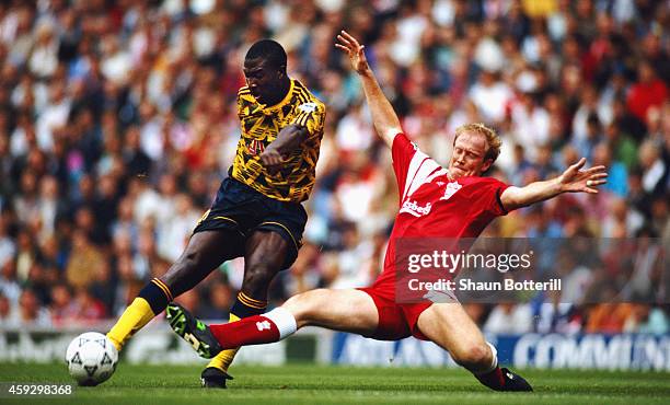 Liverpool defender Mark Wwright challenges Kevin Campbell of Arsenal during a FA Premier League match between Liverpool and Arsenal at Anfield on...