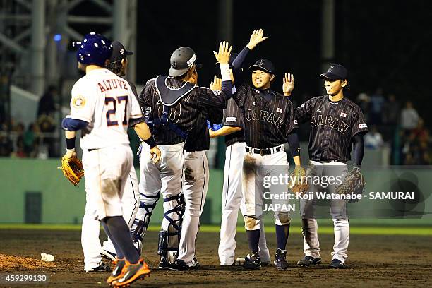 Ryosuke Kikuchi of Samurai Japan celebrates their win with his teammates after the exhibition game between Samurai Japan and MLB All Stars at Okinawa...