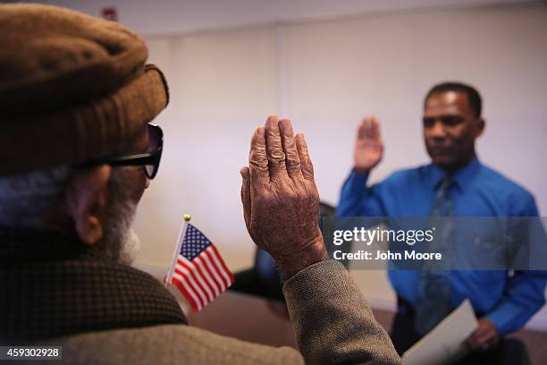 Pakistani immigrant Amanat Ali , takes the oath of citizenship to the United States on November 20, 2014 in Newark, New Jersey. Supervisory...