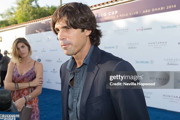 Nacho Figueras being interviewed, with his wife Delfina Blaquier looking on, before the Sentebale Polo Cup presented by Royal Salute World Polo at...
