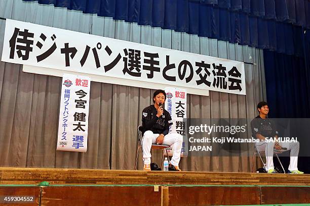 Kenta Imamiya and Shohei Otani of Samurai Japan visit a Naha school prior to the exhibition game between Samurai Japan and MLB All Stars at Okinawa...