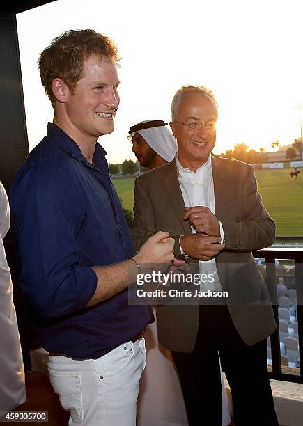 Prince Harry and Philip Green attend the Sentebale Polo Cup presented by Royal Salute World Polo at Ghantoot Polo Club on November 20, 2014 in Abu...