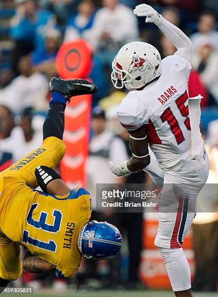 Linebacker Keith Smith of the San Jose Spartans intercepts quarterback Derek Carr on a pass intended for Davante Adams of the Fresno State Bulldogs...